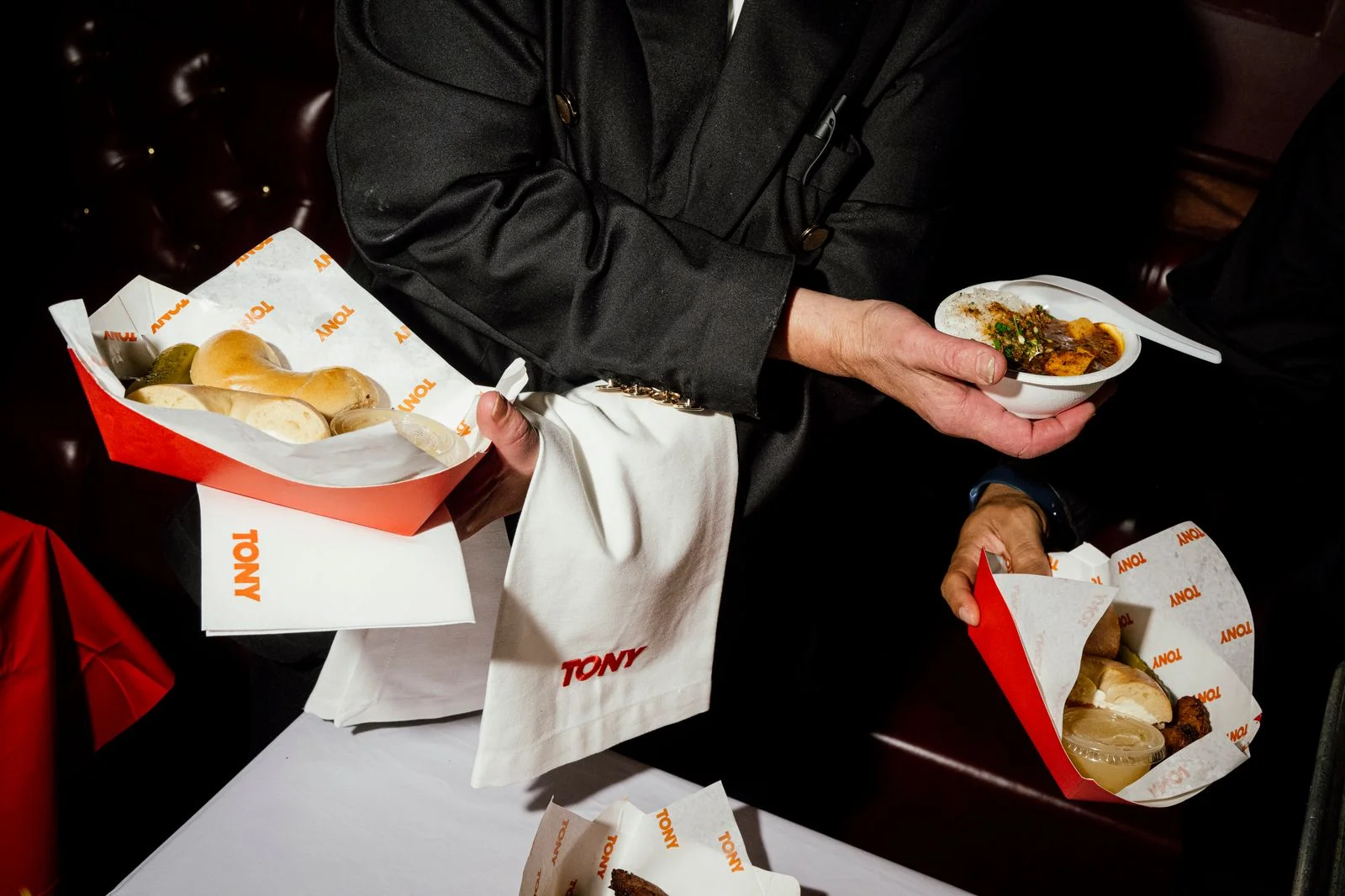 Someone serving appitzers at the premiere of Tony