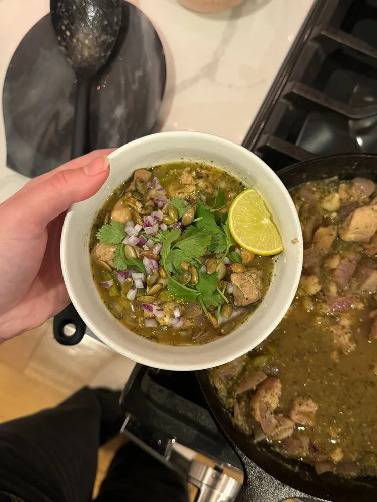 Image may contain: Food, Food Presentation, Meat, Mutton, Cutlery, Spoon, Adult, Person, and Cilantro
