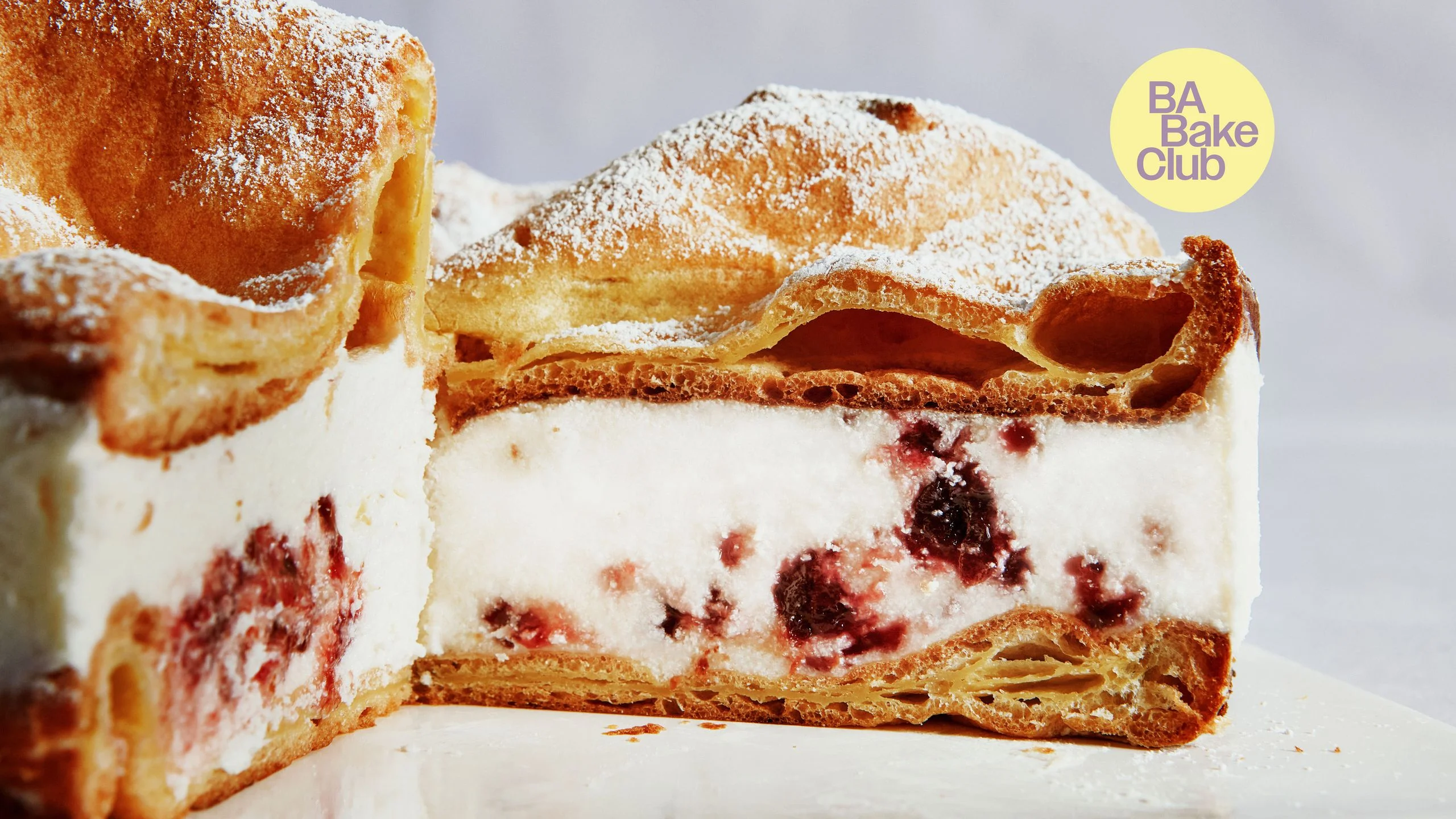 Two layers of choux pastry separated by a layer of sweetened cream cheese and plum compote.