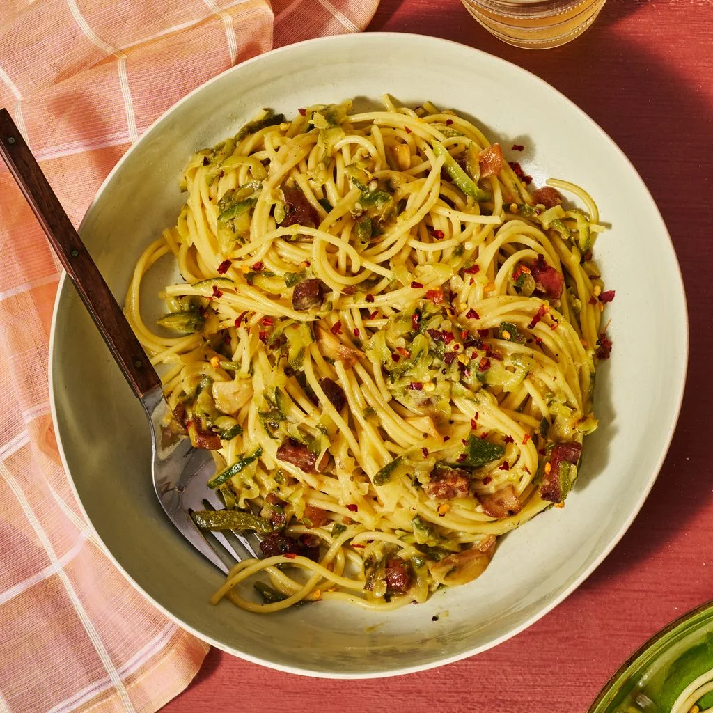 Zucchini Amatriciana beautifully twirled in a stone bowl