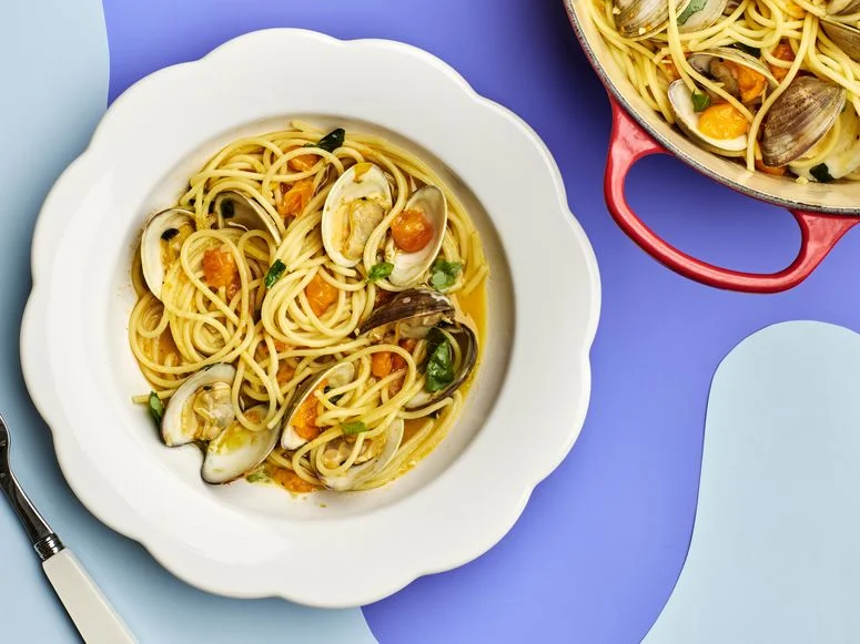 Spaghetti With Clams and Sun Gold Tomatoes in a flower shaped bowl