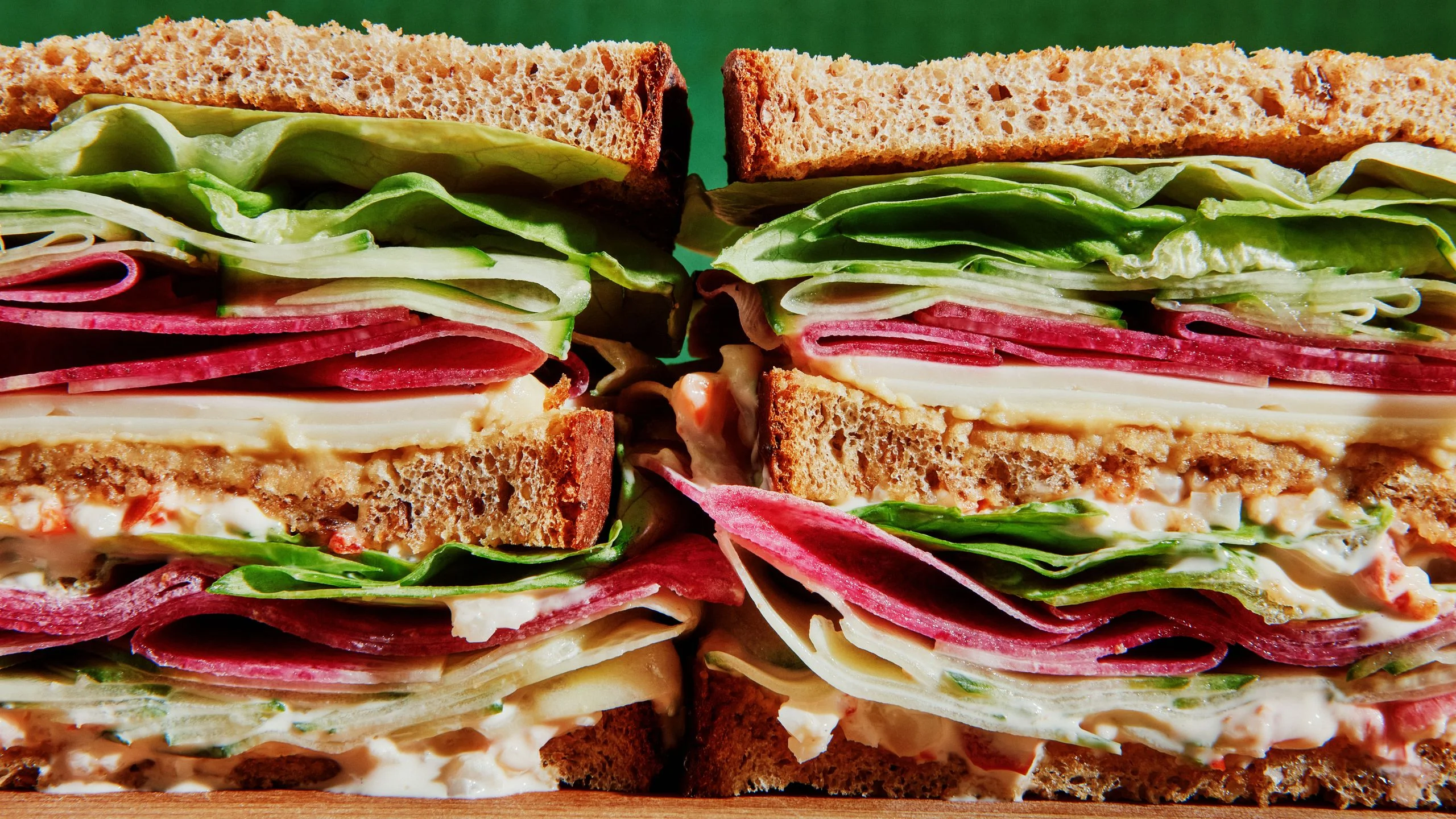 Butterhead lettuce thinly sliced cucumbers and radish white cheddar cheese hummus and giardinieramayonnaise on...