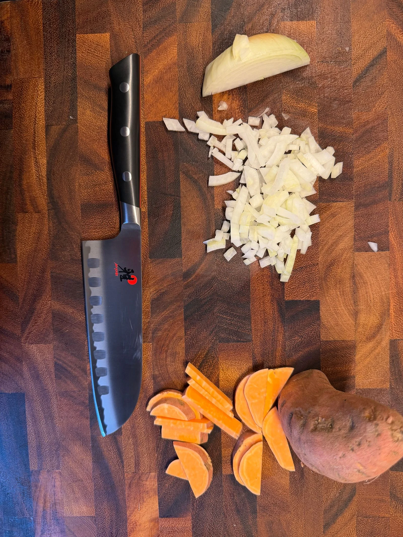 Image may contain Blade Weapon Knife Chopping Board Food and Dagger