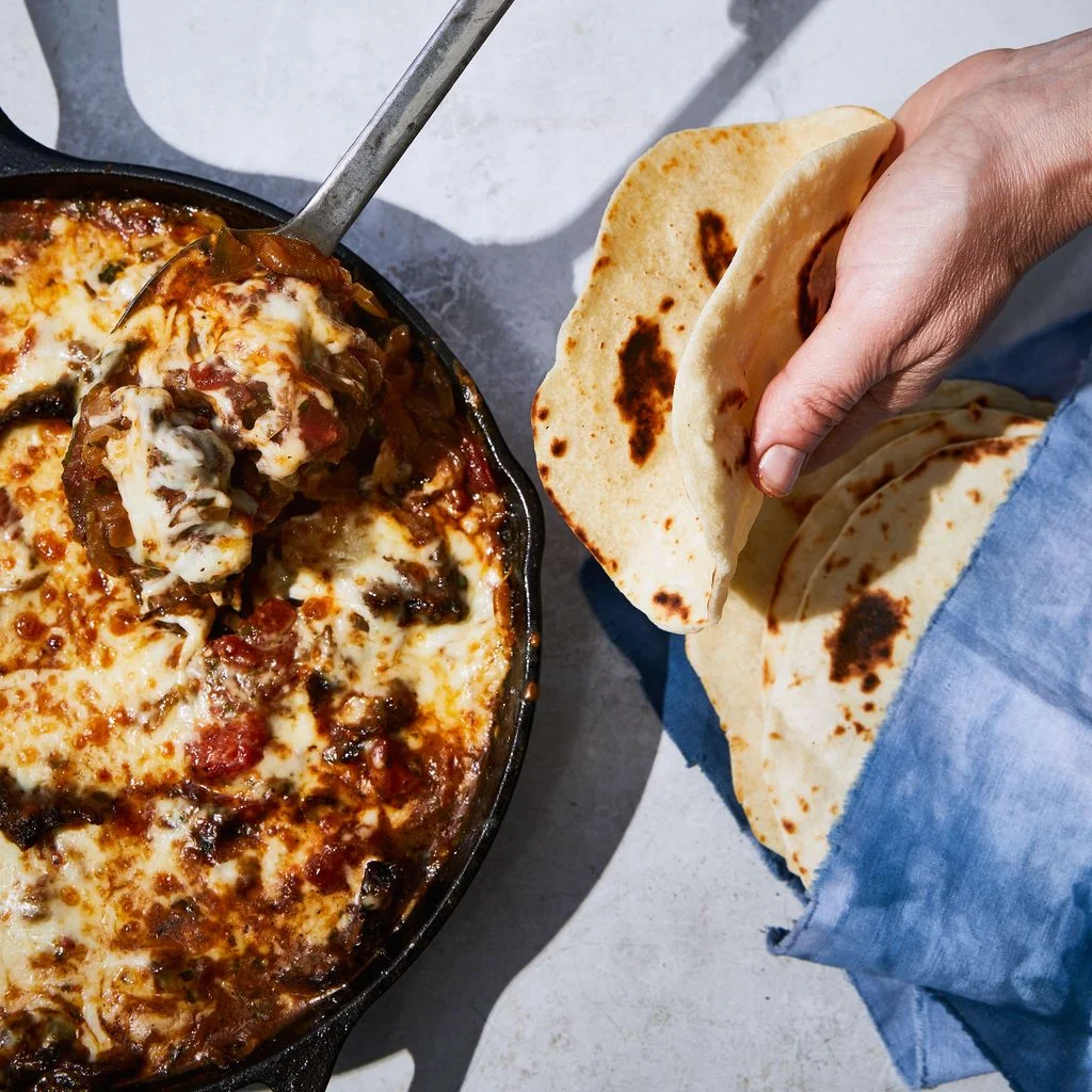 Image may contain Food Pizza Human Person Bread Cutlery and Spoon