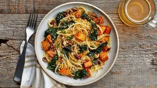Butternut squash and kale pasta topped with pecan breadcrumbs