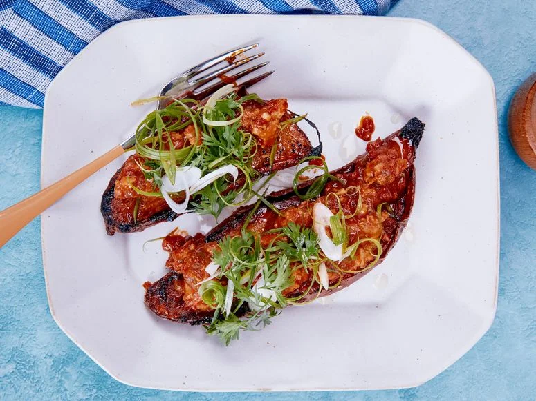 Gochujang Sweet Potatoes on a white plate