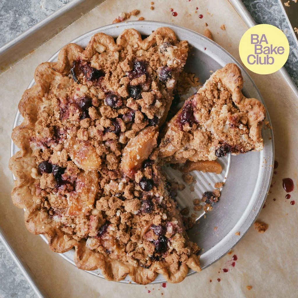 A peach and blueberry pie with a cardamom crumble topping.