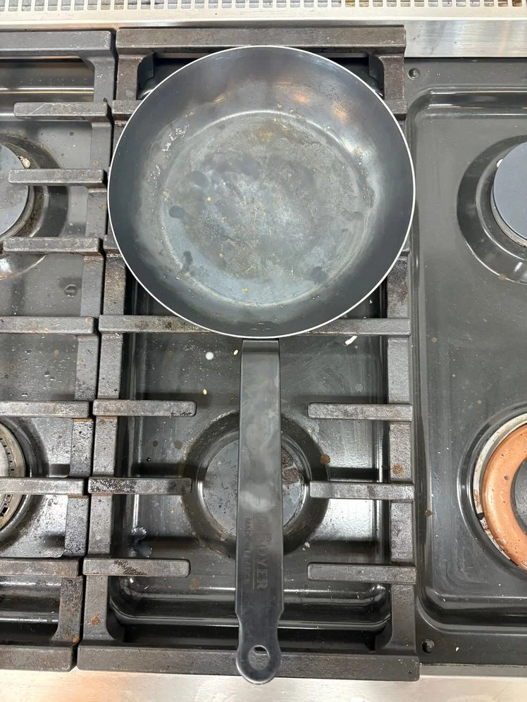 De Buyer blue carbon steel pan on stove