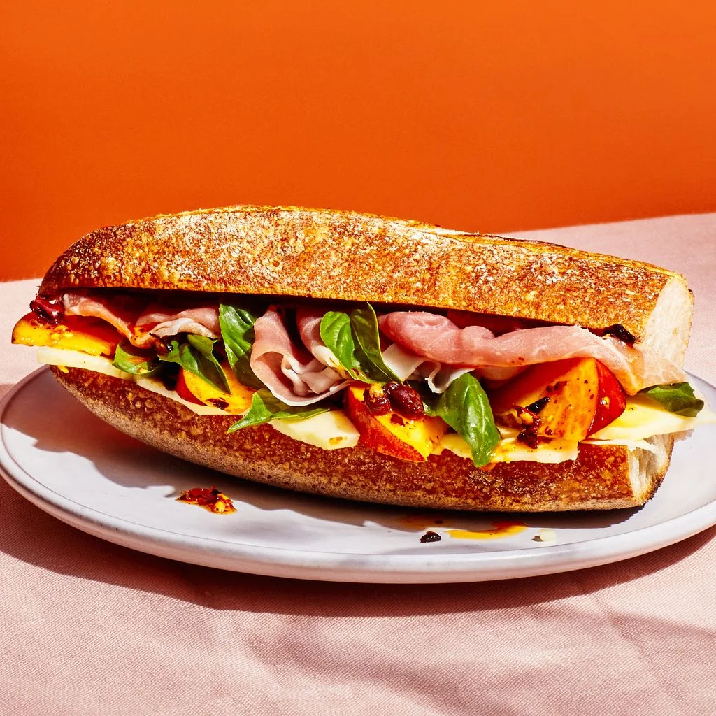 Image may contain Burger Food Sandwich and Bread