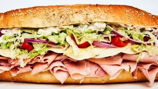 Italianstyle hoagie with ham mortadella provolone lettuce and red onion