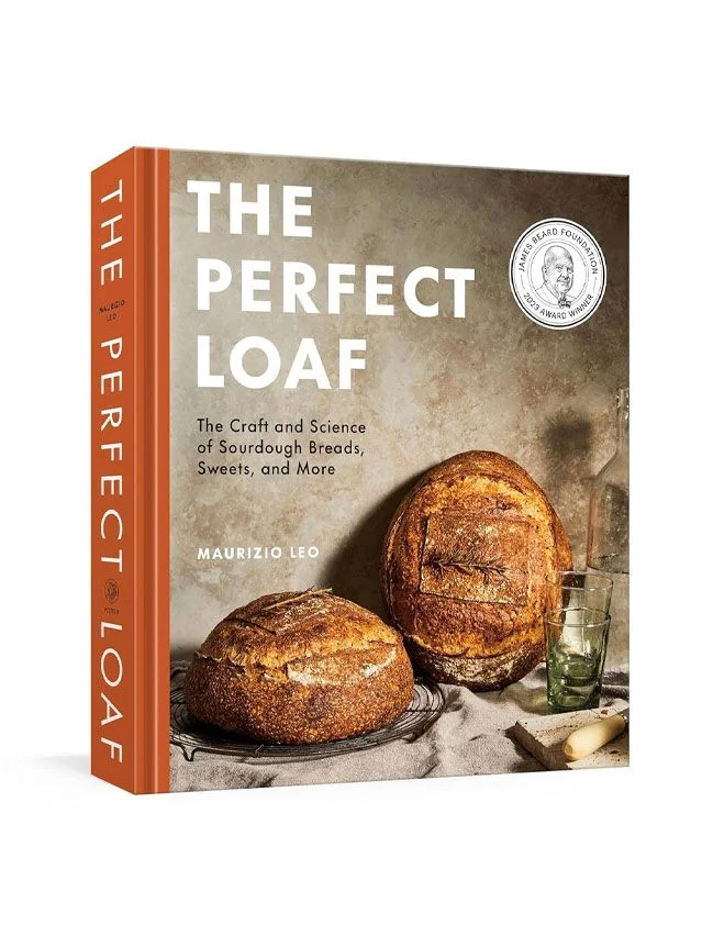 Image may contain: Bread, Food, Cup, Book, Publication, and Person